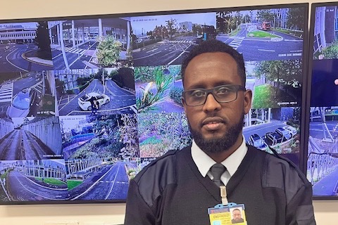 A member of the security team in the Elmpark Green control room