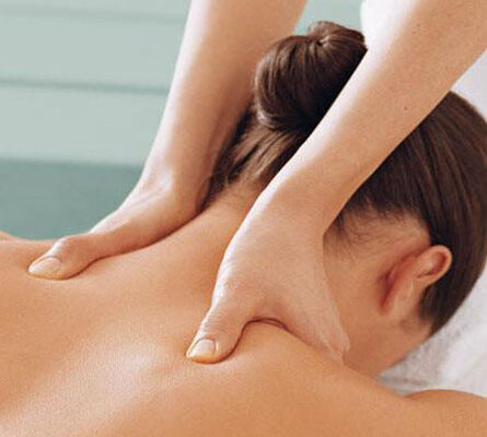 Member enjoying a chair massage at the Club